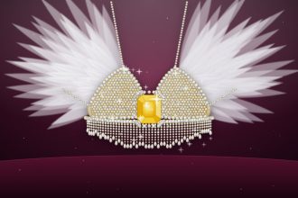 Ilustrasi Fantasy Bra Kylie Jenner bertabur berlian dengan batu kuning di tengah dan sayap bulu putih di atas latar beludru